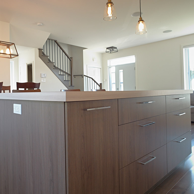 Cuisines Beauregard |Island in melamine with a laminate countertop in a contemporary kitchen